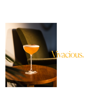 Glass of passion fruit cocktail and the word vivacious
